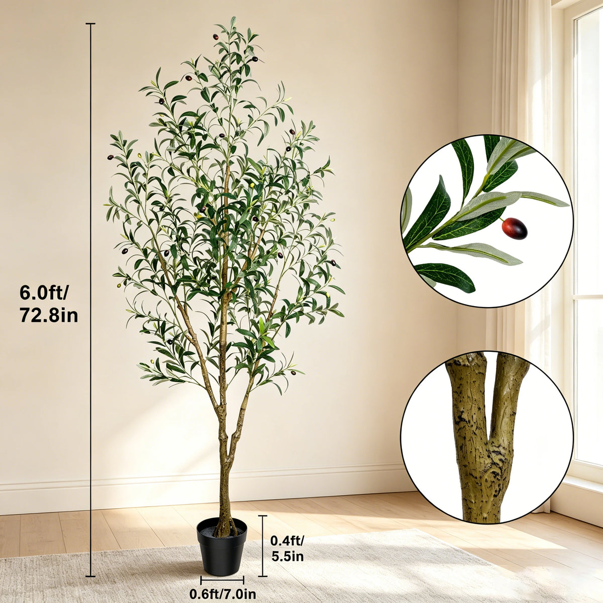 Artificial indoor olive tree with green leaves and small fruit in a black pot.