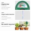 A green digital dial soil meter with dry, moist, and wet indicators.
