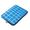 A blue plaid laptop sleeve with a zipper closure.