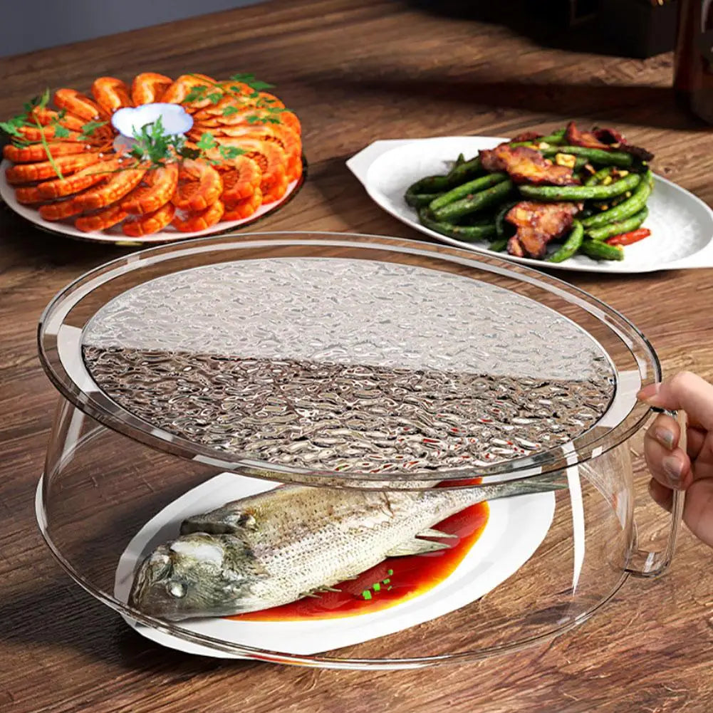 Clear microwave splatter cover with a heat-resistant handle placed over a fish on a white plate.