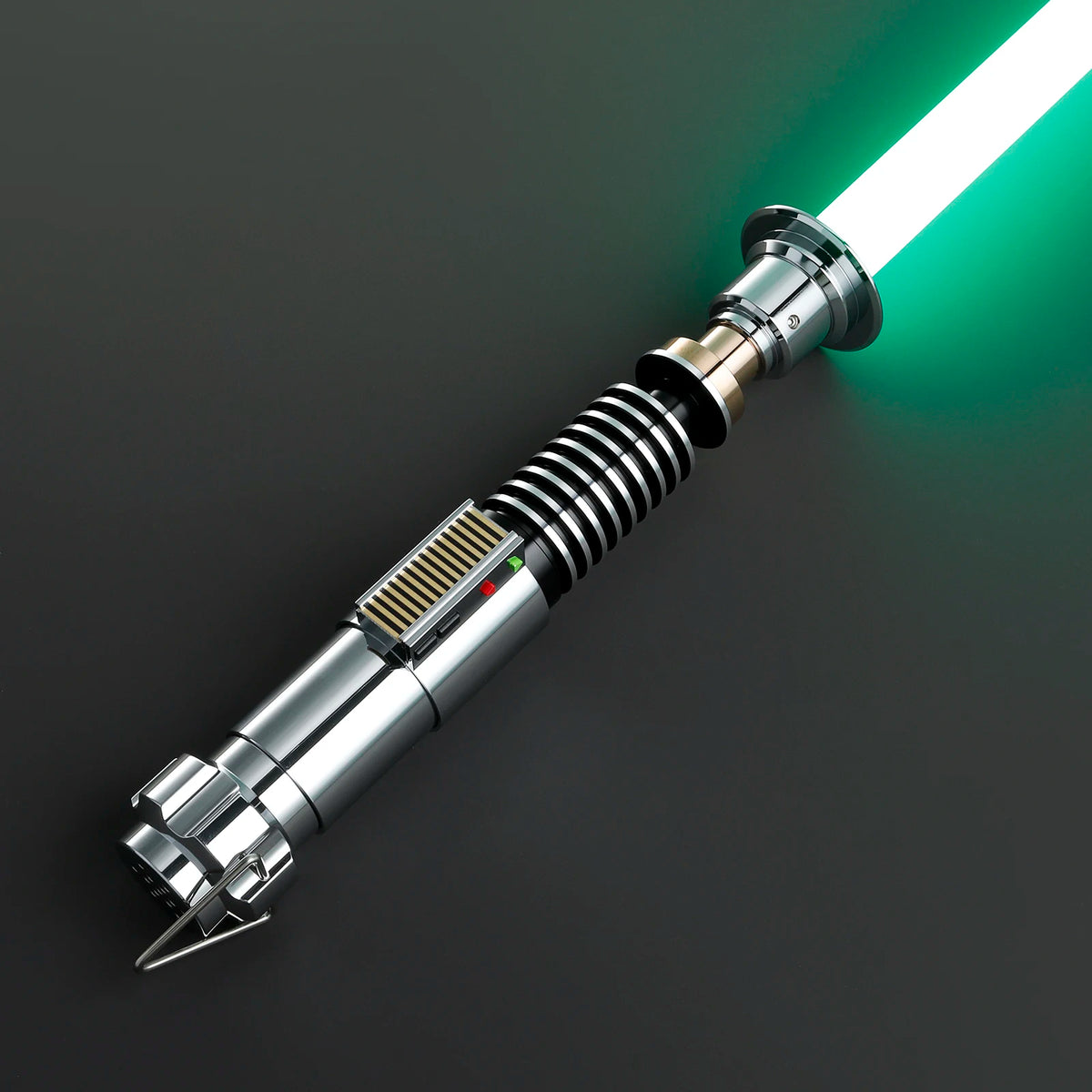 A metallic lightsaber hilt with a glowing green blade is shown against a dark background.