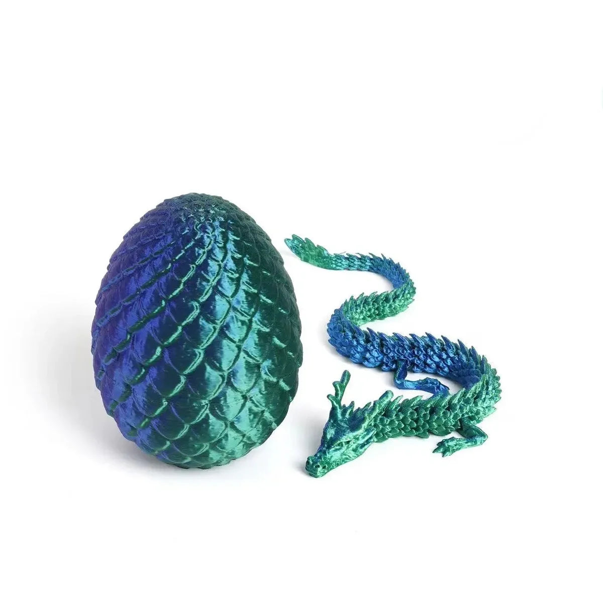 A textured, deep blue dragon egg and a matching green dragon figurine are displayed against a white background.