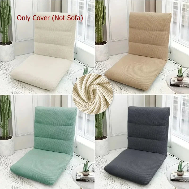 A collection of foldable floor sofa covers in beige, light green, and dark gray fabric displayed on chairs.