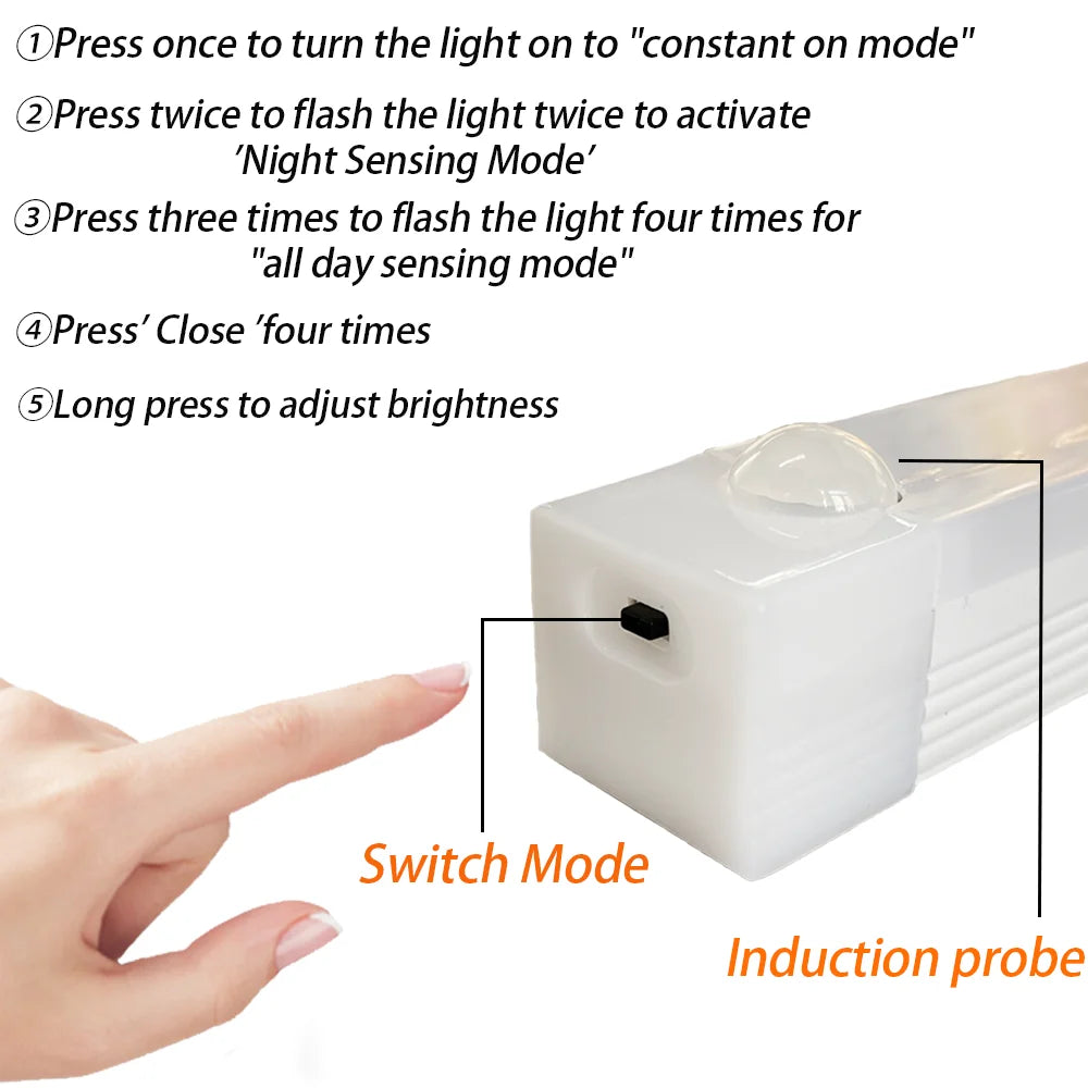 A hand is shown pressing a switch on an induction probe device to change the light mode.