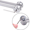 A close-up view of a silver tuning fork with an activator, showing the mechanism for sound healing.
