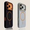 A black phone case with a gold magnetic ring and a silver phone featuring a matching orange magnetic ring.