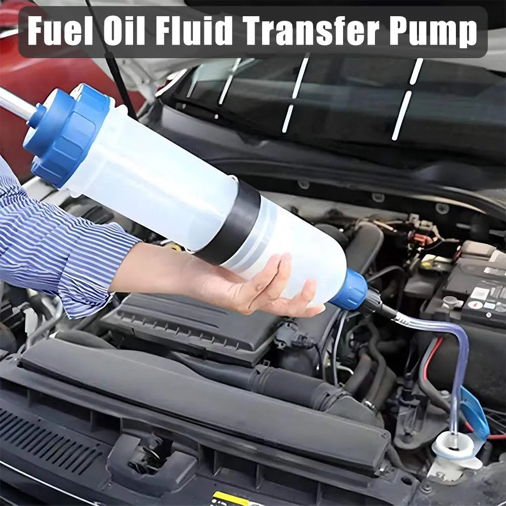 A hand is using a blue fuel oil fluid transfer pump to extract fluid from a vehicle engine.