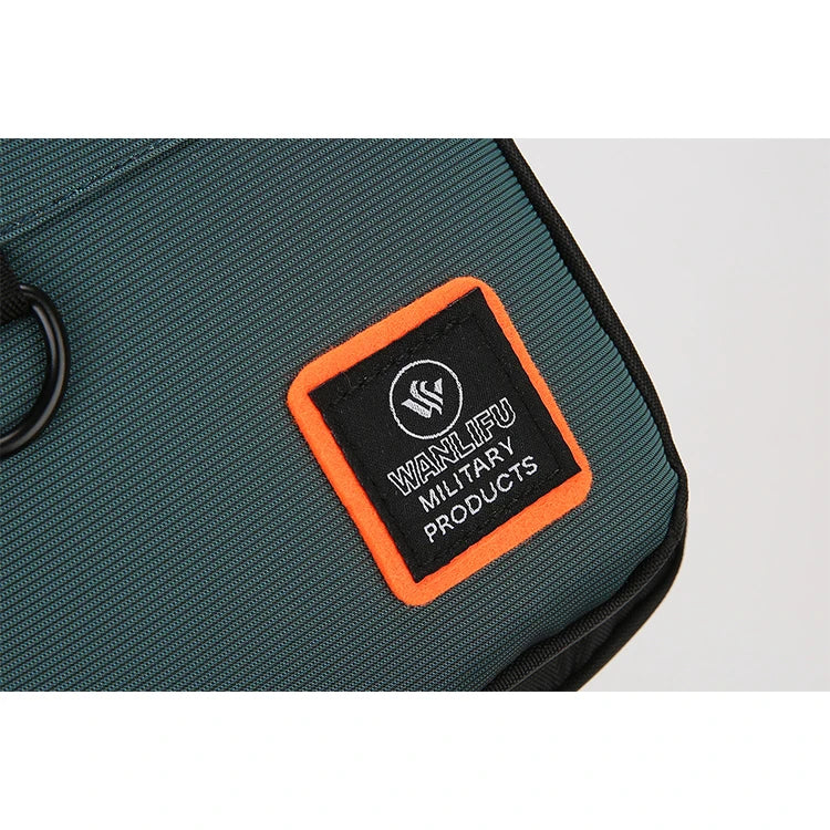 A close-up of a dark green water-resistant crossbody bag with an orange patch featuring the WANLIU logo.