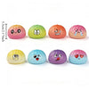 Collection de jouets anti-stress molles colorés dans diverses nuances pastel et expressions.