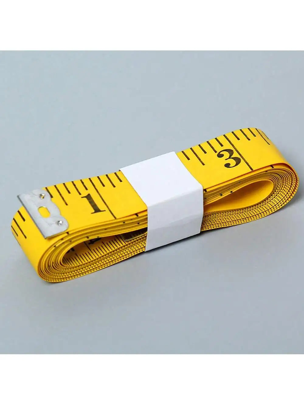 Yellow flexible measuring tape with white markings and a metal clasp.