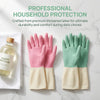 A set of pink and green disposable latex-free household protection gloves displayed on a white marble surface.