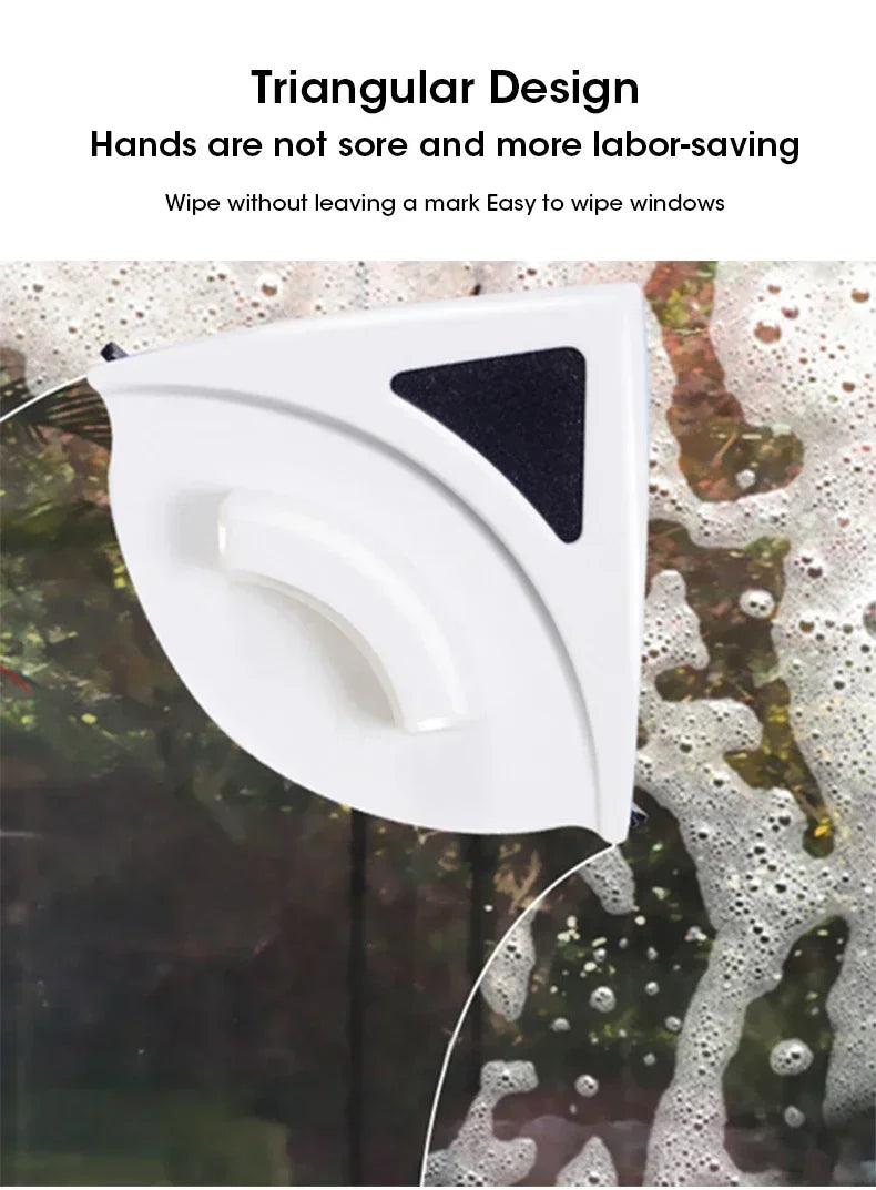 A white triangular magnetic window cleaner is shown wiping a window surface.