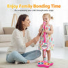 A mother and child enjoy family bonding time with a pink karaoke microphone stand.