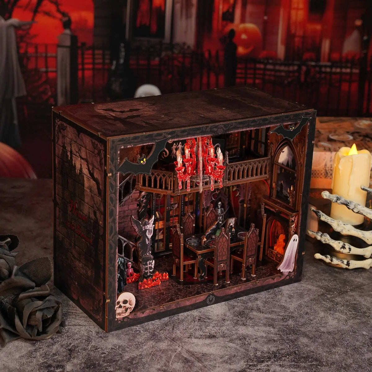 A wooden book nook kit featuring a spooky Halloween miniature shelf insert with detailed figures and LED lights.