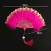 Pink lace folding hand fan with a vibrant pink feather and a decorative handle