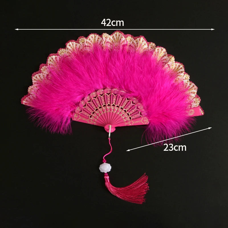 Pink lace folding hand fan with a vibrant pink feather and a decorative handle