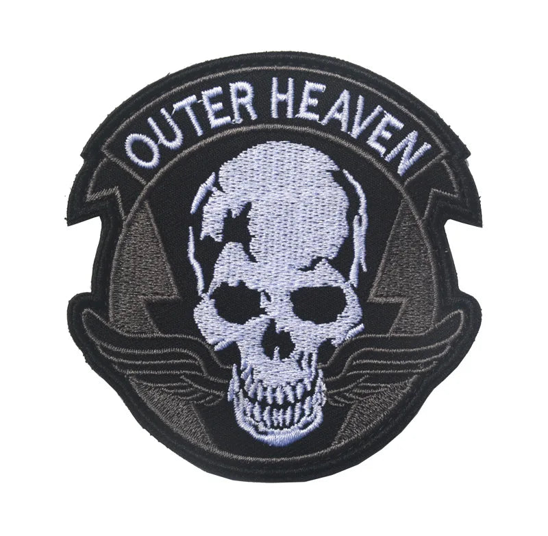 Black embroidered patch featuring a white skull with wings and the text OUTER HEAVEN