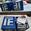 A box of Drink IF adult drinking game cards and a keyboard are displayed on a table.