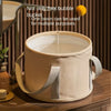 A beige fabric foot soak tub is shown with a liquid being poured into it, emphasizing its multi-purpose use.