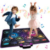 A young girl and boy dancing on an interactive music dance mat with lights for kids.
