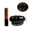 A handcrafted Tibetan singing bowl with a wooden striker and blue cushion shown in various views.