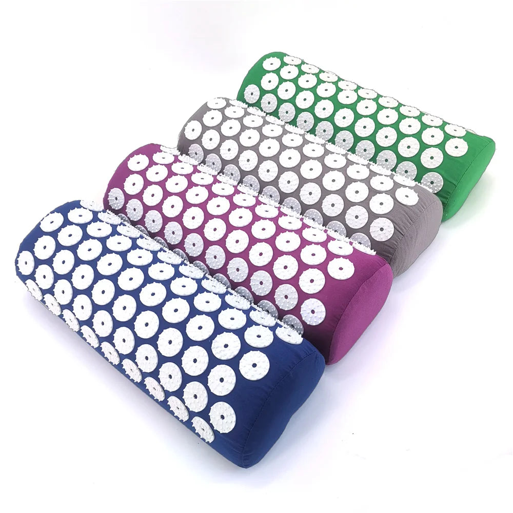 A set of five colored acupressure mats and pillows for pain relief and relaxation
