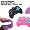 Various silicone game controllers in pink and purple colors used as teethers for babies.
