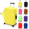A collection of brightly colored elastic travel luggage covers for suitcases displayed in various shades including yellow, pi