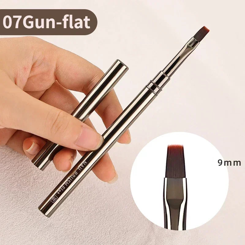 A hand holds a precision 07Gun-flat nail art brush set with a 9mm tip, showing the brush design.