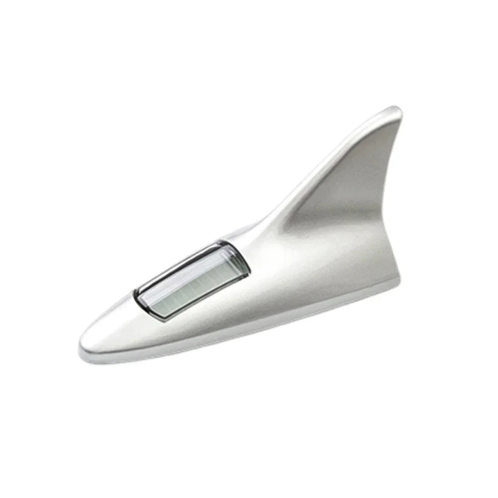 Silver solar-powered shark fin antenna with an integrated LED safety light