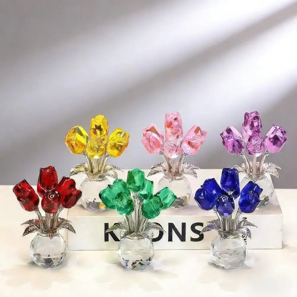 A collection of crystal rose sculptures featuring colorful reflective bouquets in yellow, pink, purple, and blue.