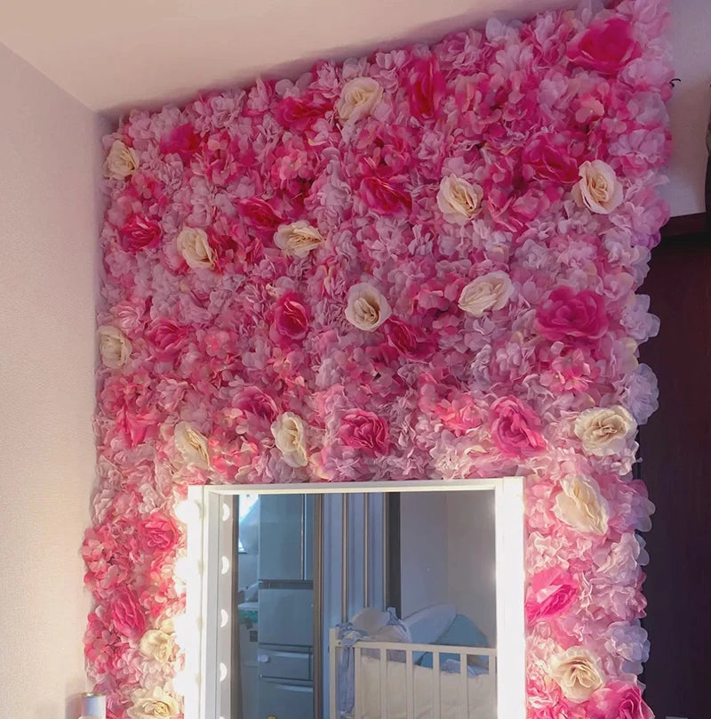 A vibrant pink silk rose flower wall panel used as a backdrop for weddings and events.