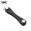 A black aluminum key clip featuring a carabiner hook.