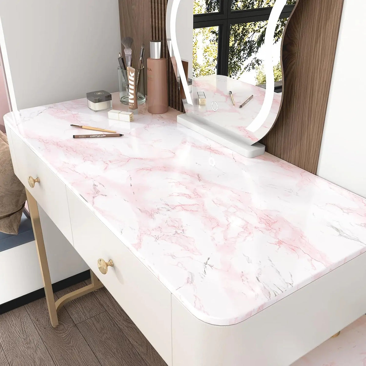 A vanity table with a white marble top and a large mirror reflecting the room.