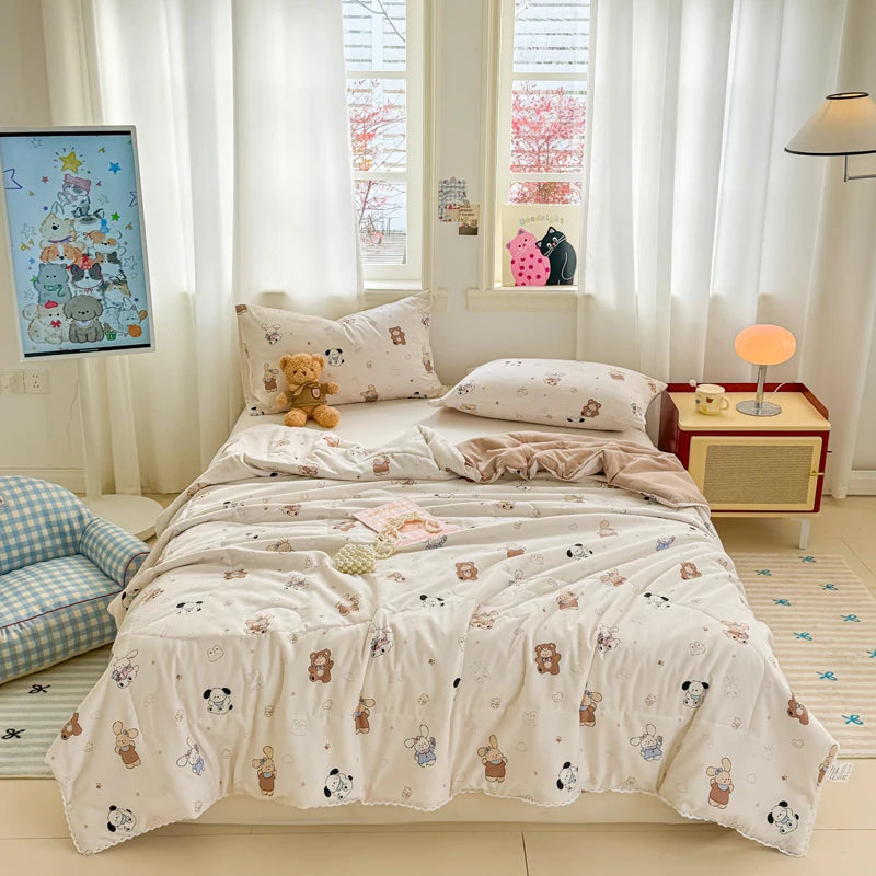 A light pink and white lace-trimmed duvet is displayed on a bed in a bright, airy room.