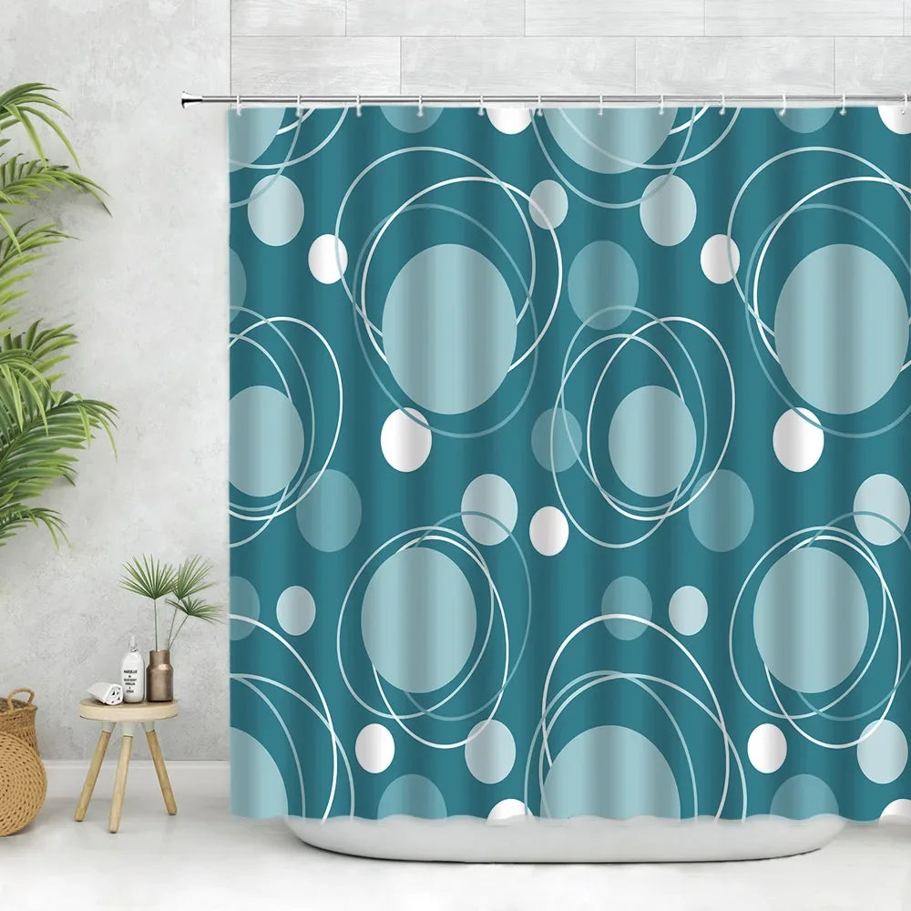 A teal fabric shower curtain featuring a geometric pattern of white circles and curved lines.