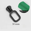 A black resin zipper slider repair kit with a green fabric detail is shown on a white background.