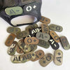A collection of reflective glow-in-the-dark blood type tactical patches with hook and loop backing