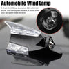 A shark fin LED car decoration light with wind power mounted on a black surface.