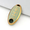 A light green TPU car key case cover with gold accents and a slot for a key.