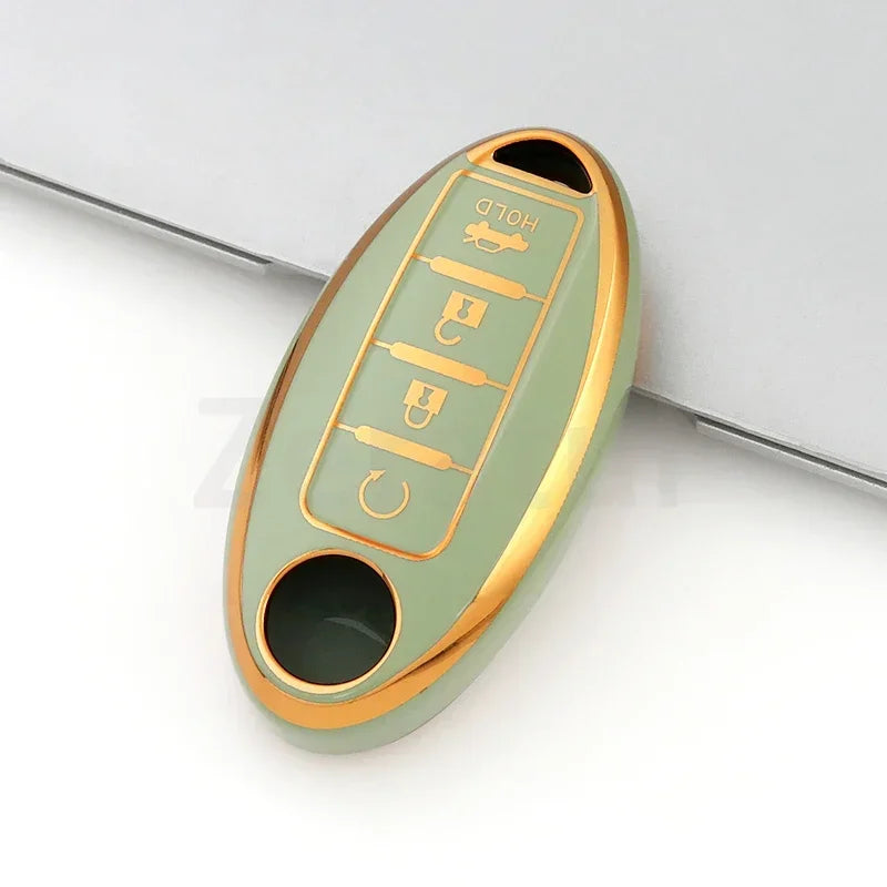A light green TPU car key case cover with gold accents and a slot for a key.