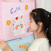 A young woman holds a pink foldable storage bag featuring a cute rabbit design and the word Cute.