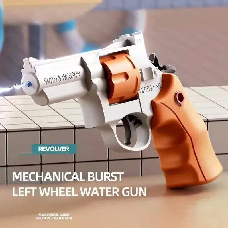 A white mechanical burst revolver water gun with an orange grip is shown on a surface.