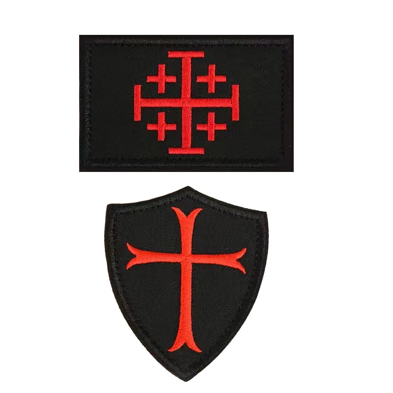 Black embroidered patch featuring a red Templar cross design on a shield shape.