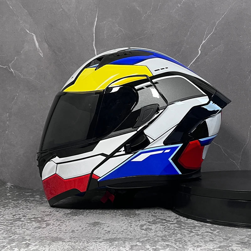 A modular flip-up motorcycle helmet featuring a white and black design with yellow and blue accents.
