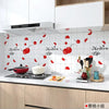 Modern life kitchen splashback featuring red leaf-shaped stickers on a white tiled wall.