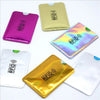 A collection of five RFID-blocking aluminum card holders in various colors including pink, gold, and silver.
