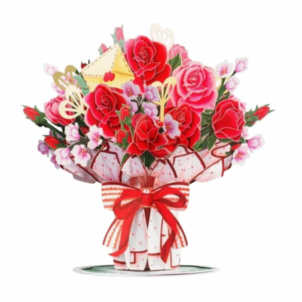 A vibrant bouquet of red and pink roses and cherry blossoms presented in a card arrangement.