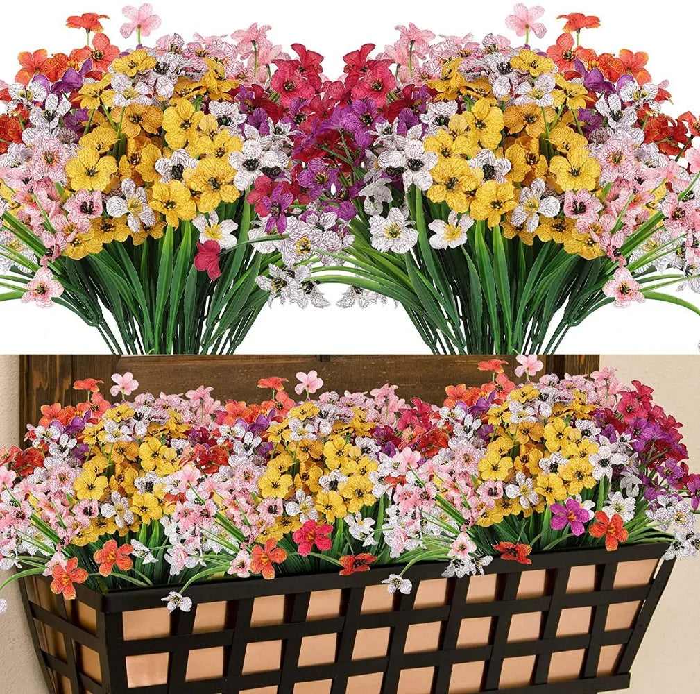 Un vibrante ramo de narcisos artificiales con flores rosa, amarilla y morada.