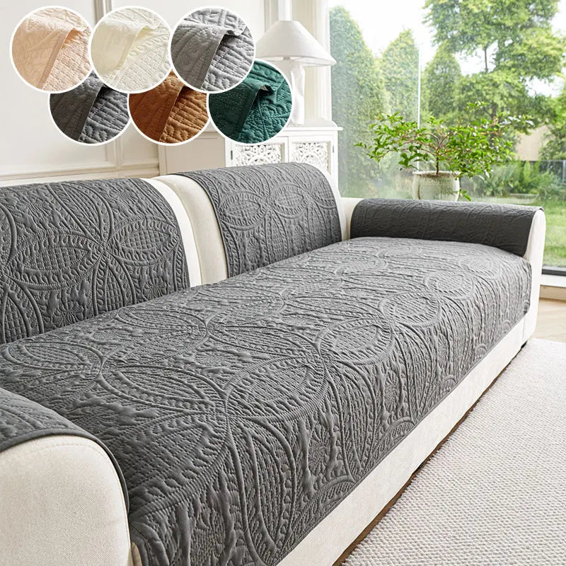 A gray anti-slip sofa cover is displayed on a light-colored sofa, with swatches showing various shades of gray and brown.